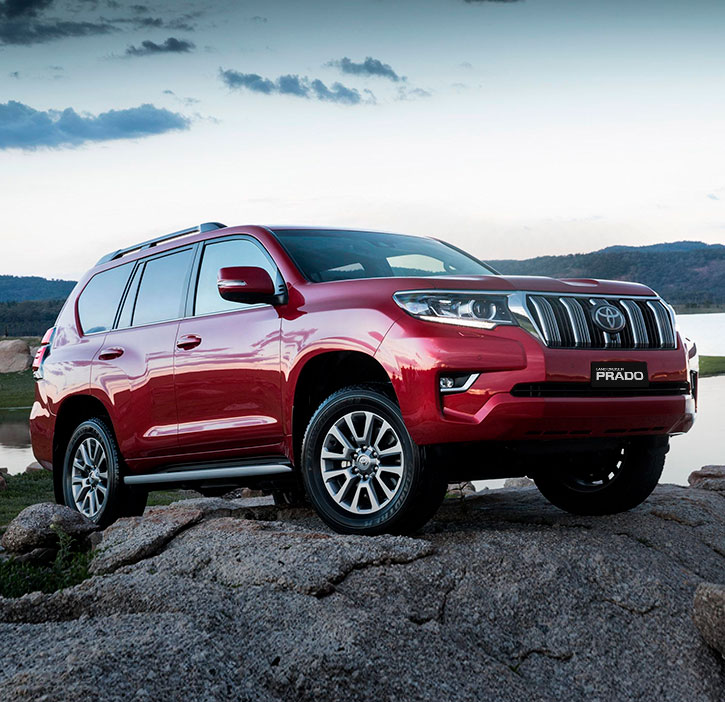 Land Cruiser Prado  roja de  perfil 